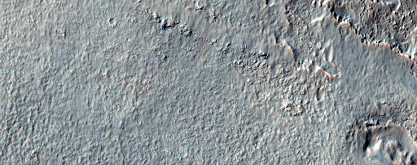 Small Craters and Channel on Large Crater Rim
