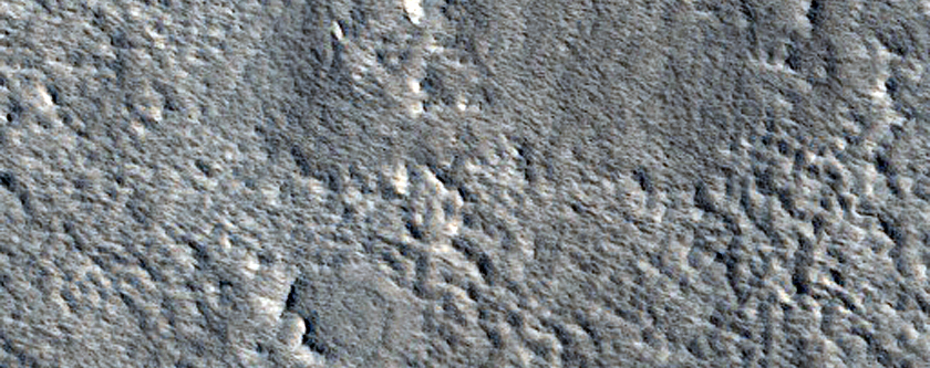 Layered Mesa in Crater in Galaxias Fossae Region
