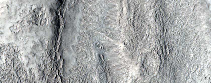 Light-Toned Material in Fresh Shallow Valleys

