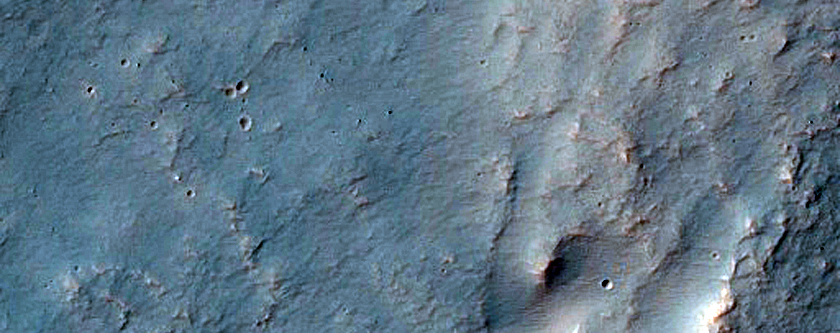 Channel Entering Crater in Northern Hellas Planitia
