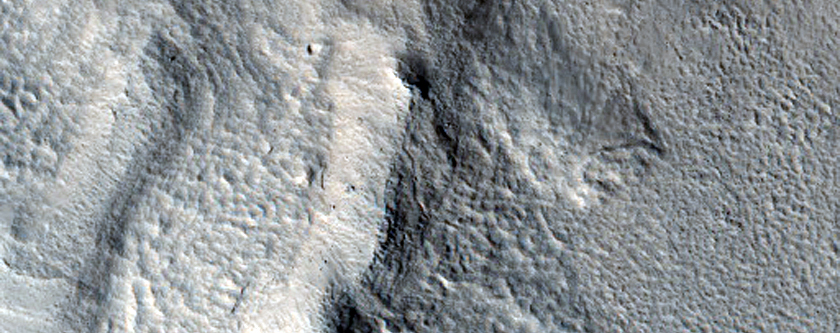 Layered Deposits in Craters Near Hrad Vallis

