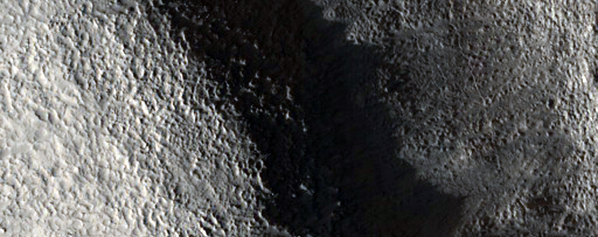 Dipping Layers along Valley Wall in Arabia Terra
