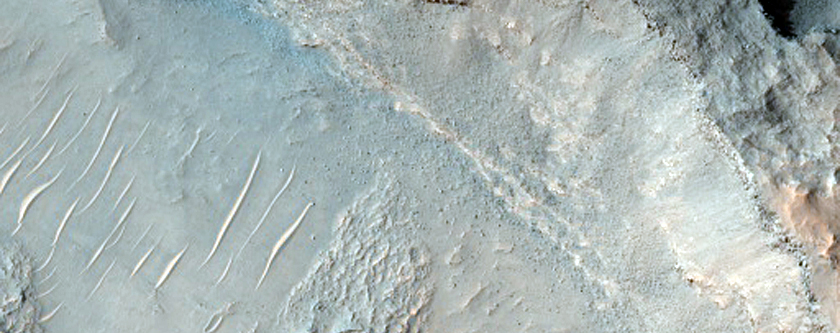 Bedrock Exposed in Crater Floor Pit
