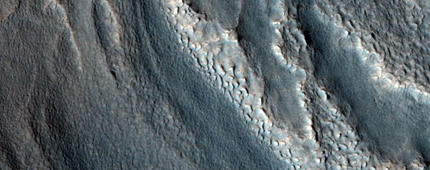Layers Exposed in Crater in Deuteronilus Mensae
