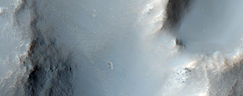 Flow Features from Near-Rim Ejecta of Bakhuysen Crater
