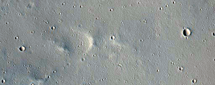 Ejecta Crossing Trough in Tractus Fossae

