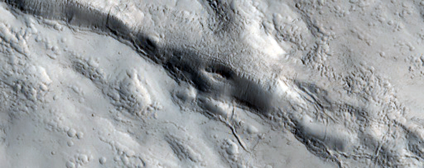 Short Channels in Ejecta of Northern Mid-Latitude Crater