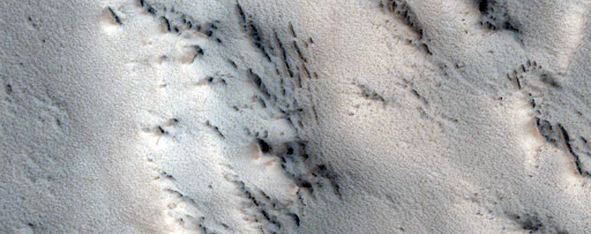 Layers in Rim of Old Crater in Marte Vallis Region
