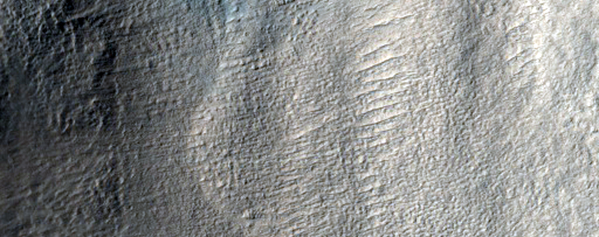 Layered Deposits in Crater in Terra Cimmeria
