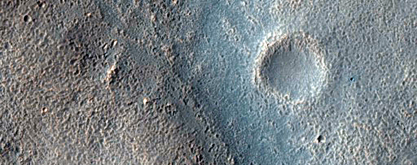 Layered Feature in Crater in Hellas Montes Region
