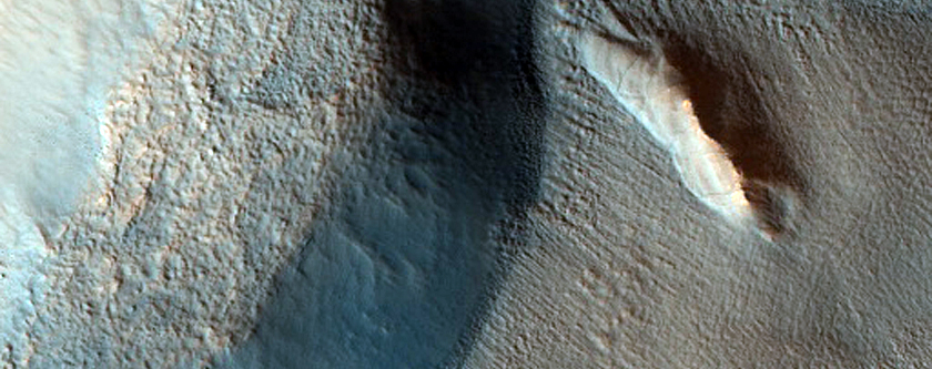 Dipping Layers along Outside Rim of Crater in Deuteronilus Mense
