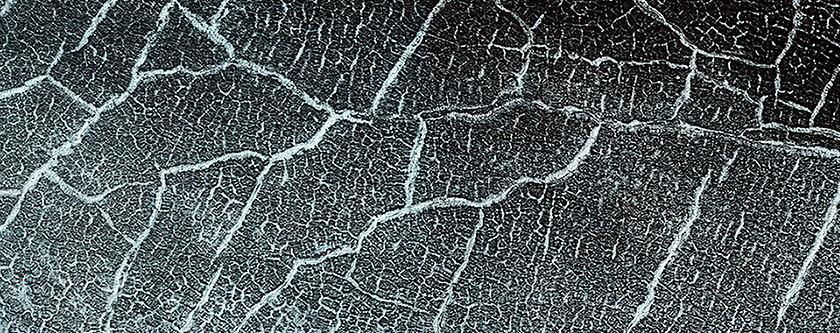 Cracks in a Crater’s Ice