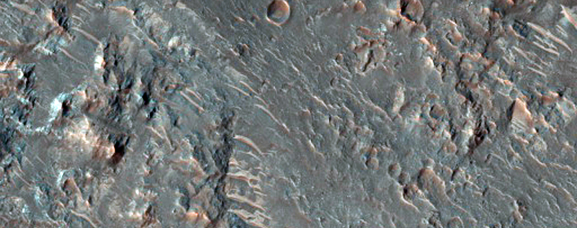 Phyllosilicates in Ejecta of Crater on Rim of Larger Crater
