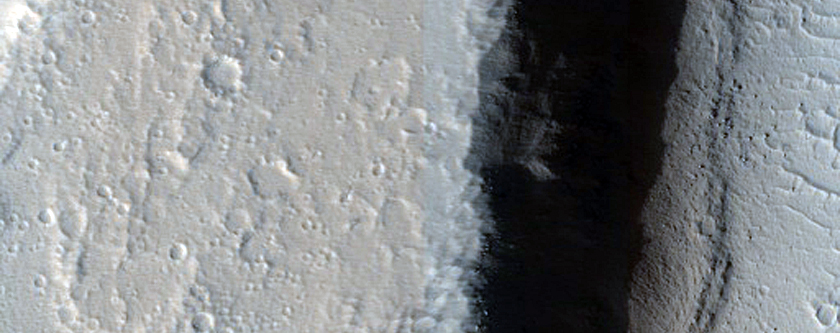 Crater in Ceraunius Fossae Region
