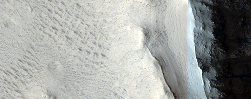 Layers in Pedestal Crater within Tikhonravov Crater
