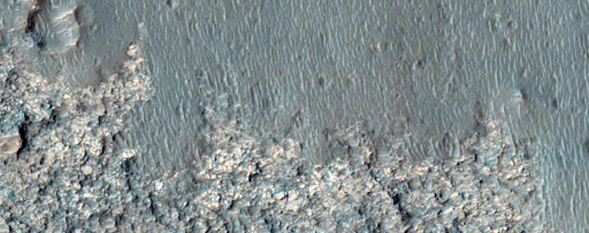 Light-Toned Surface with Parallel Ridges in Crater Interior
