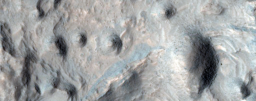 Eroded Layered Deposits on Floor of Large Crater