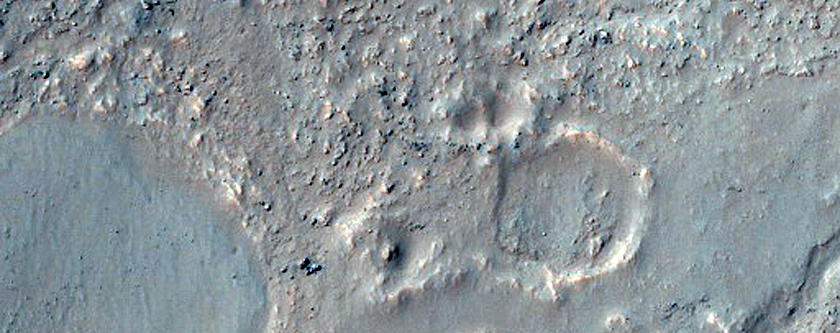 Pitted Material in Northern Rim of Lowell Crater