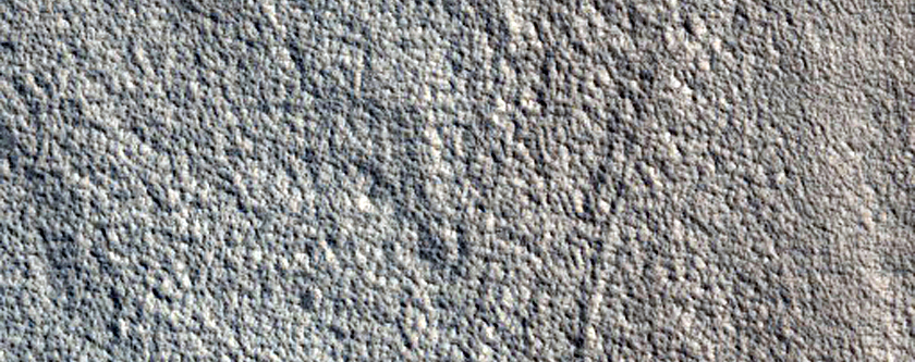 Crater with Flow Feature in Northern Mid-Latitudes