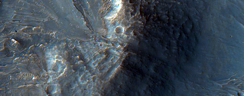 Impact Crater on Steep Slopes of Juventae Chasma