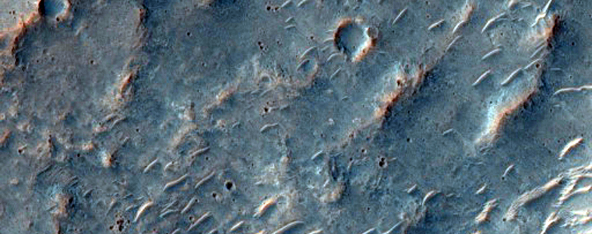 Possible Low Calcium Pyroxene-Rich Crater Ejecta in Hesperia Planum