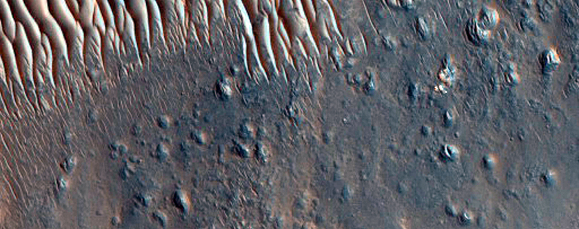 Light-Toned Outcrops North of Oudemans Crater
