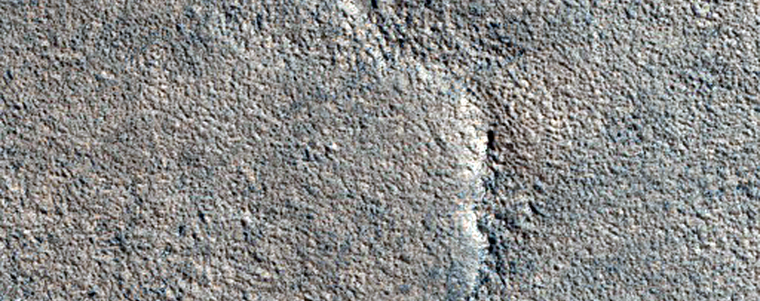 Crater with Odd Ejecta in Tartarus Colles Region
