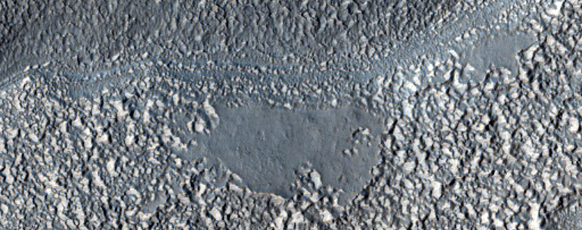 Channels Leaving Old Crater in Terra Cimmeria
