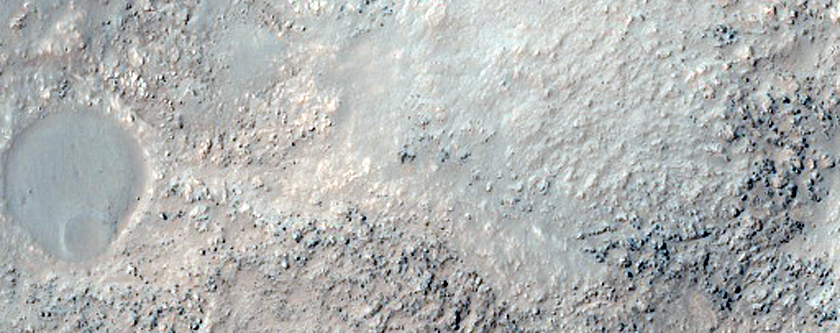Pitted Material in Northern Rim of Lowell Crater
