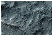 Light-Toned Chaos Material along an Older Crater Rim
