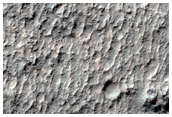 Curved Ridges and Mesa-Forming Unit in CTX Image