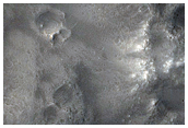 Possible Phyllosilicates in Crater Ejecta along Dichotomy Boundary
