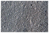Small Crater in Tempe Terra with Gullies and Outflow Channel
