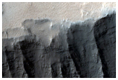 Crater on the Rim of Tithonium Chasma
