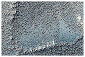 Elongated Pits on Top of Ridge in Syria Planum
