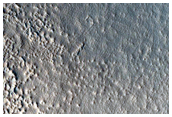 Crater Adjacent to a Scarp in North Tempe Terra
