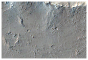 Pits Fissures and Channels East of Olympus Mons
