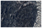 Breached Crater Wall in Daedalia Planum
