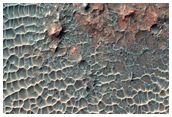 Rocky Impact Crater on Floor of Larger Crater
