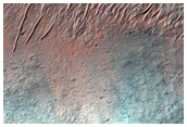 Possible Bedrock Exposures in Degraded Terrain North of Tyrrhenus Mons
