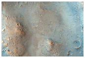 Poona Crater Ejecta Spilling into Kasei Valles
