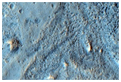 Fan Material at Channel Termini in Bamberg Crater Ejecta
