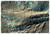 Dipping Layers in Crater in Hellas Montes Region
