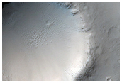 Flow Ejecta Interacting with Small Craters
