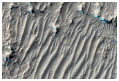 Layered Rocks on Crater Floor
