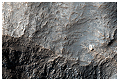 3-Kilometer Crater and Bedrock Exposures North of Hellas Planitia
