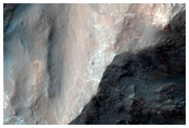 Monitor Low Albedo Slopes along Coprates Chasma Ridge
