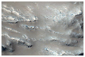 Flow over Crater Rim Onto Crater Floor in Daedalia Planum
