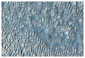 Impact Crater and Ejecta Partially Buried by Lobate Debris Apron
