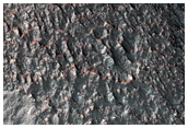 Tongue-Shaped Deposits on Crater Wall in Claritas Fossae
